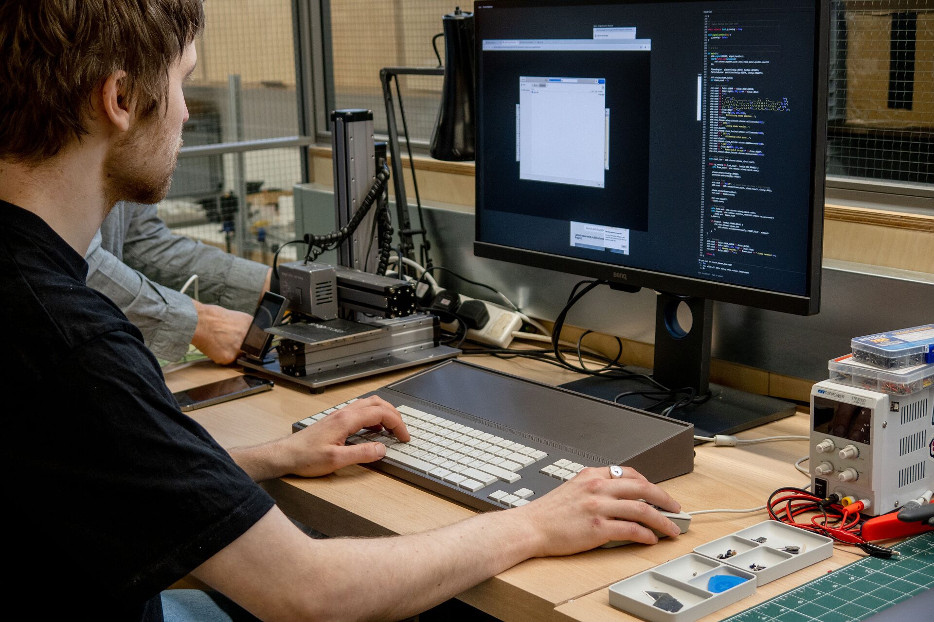 Anonymous person, totally not Dan, working on the c100 in the workshop